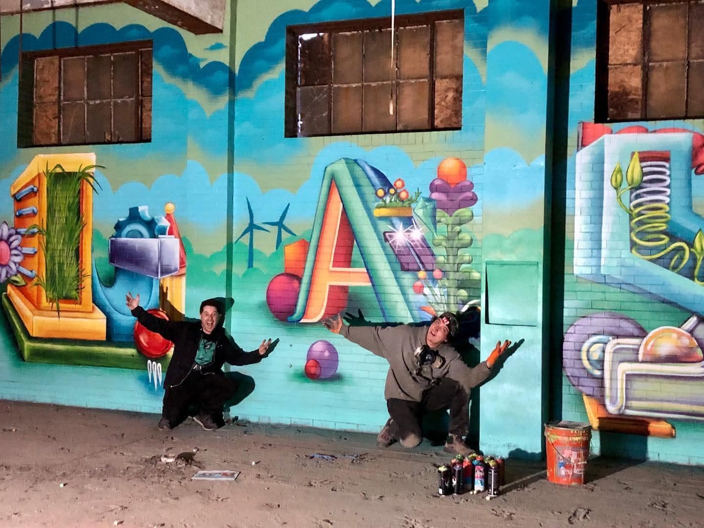 Shane and Max with their PLAY Mural in Tribune Building | Neighborhood North