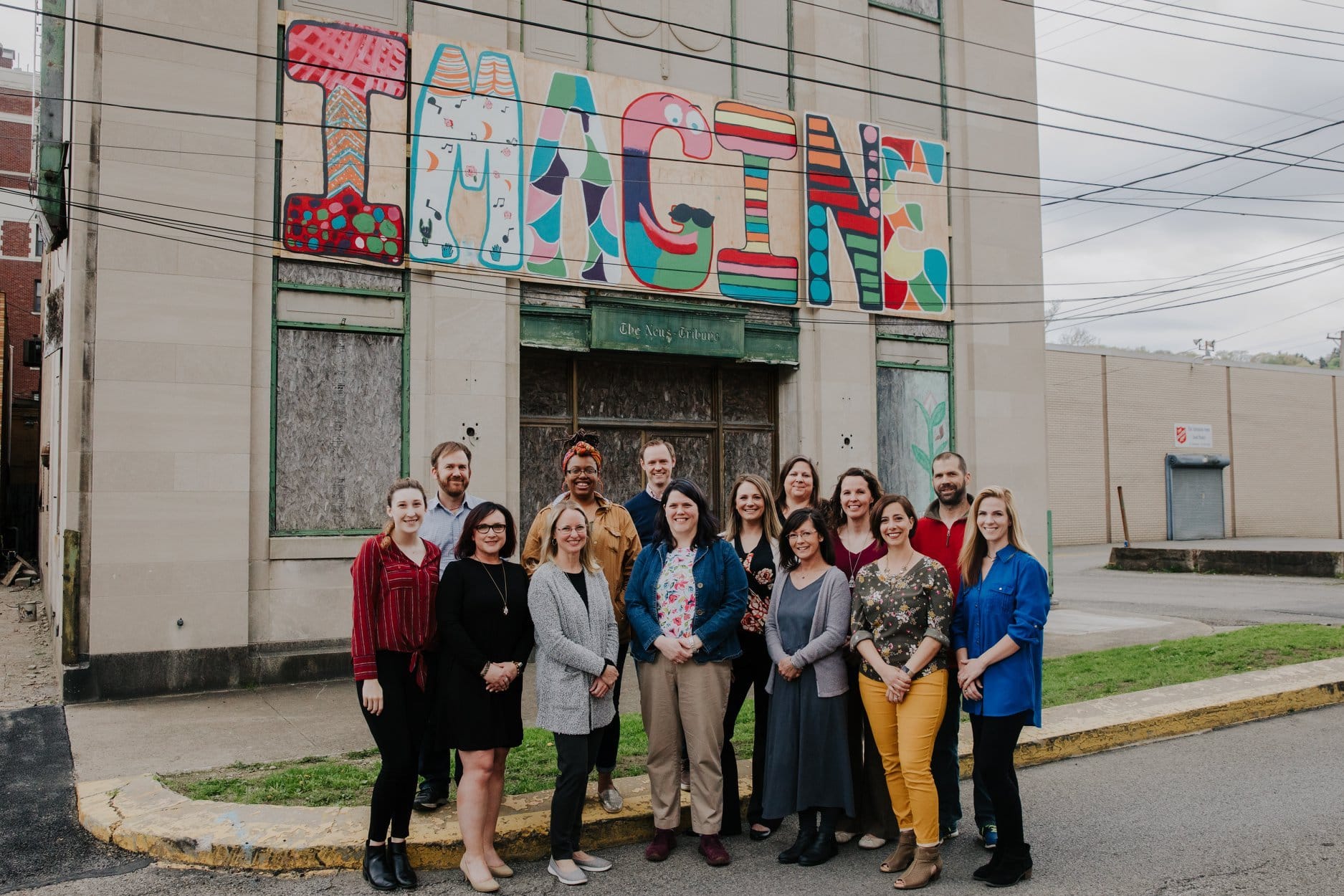 Staff with IMAGINE Mural | Children's Museum in Beaver County