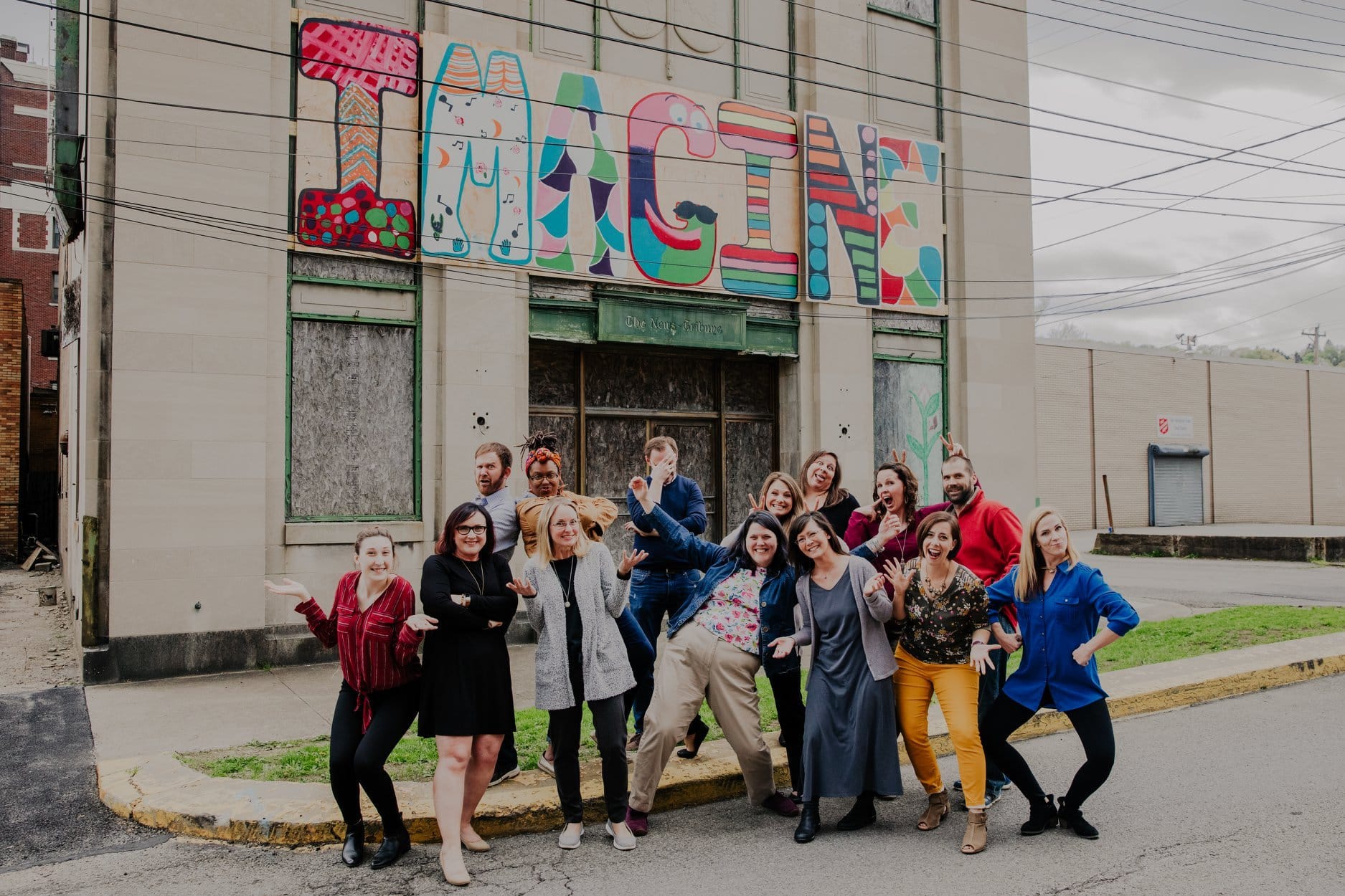 Staff with IMAGINE Mural | Children's Museum in Beaver County