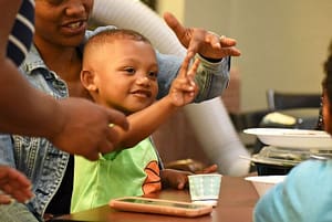 Kid playing with caregiver