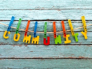 The word "community" on a clothes line