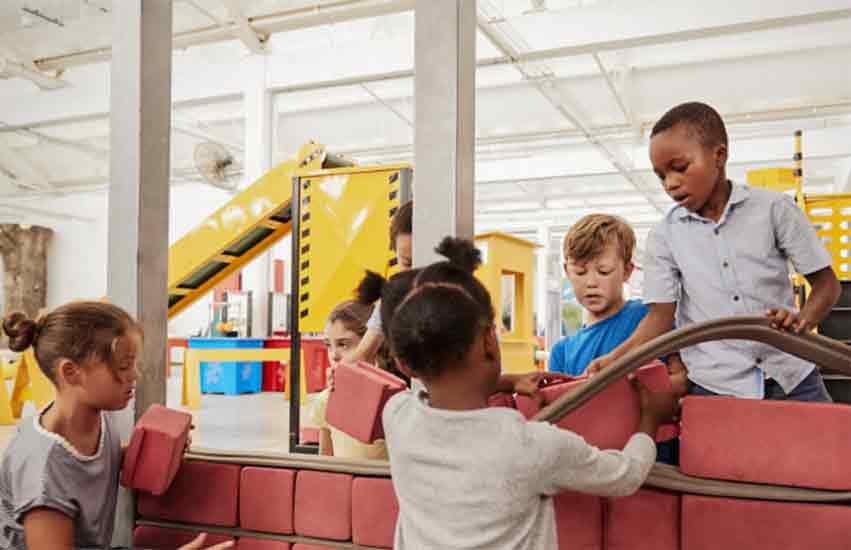Kids with a car exhibit